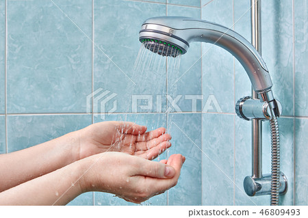 palms under rain shower head with handheld sprayer 46809493