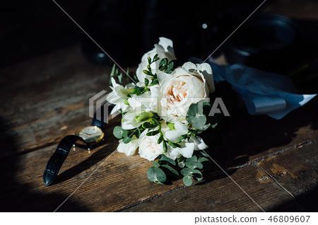 Wedding groom accessories. Shoes, bouquet, belt and socks in a top view. Wedding groom accessories. Shoes, bouquet, belt and socks in a top view. 46809607