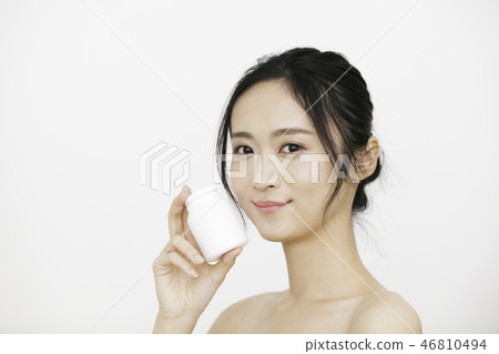 20's woman with supplement container 46810494