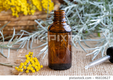 A bottle of helichrysum essential oil 46810627