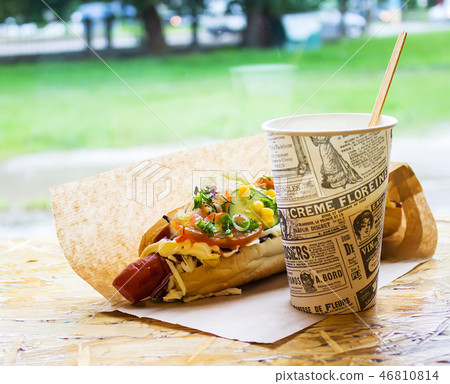 Hot dogs and hot drink on the street background Hot dogs and hot drink on the street background 46810814