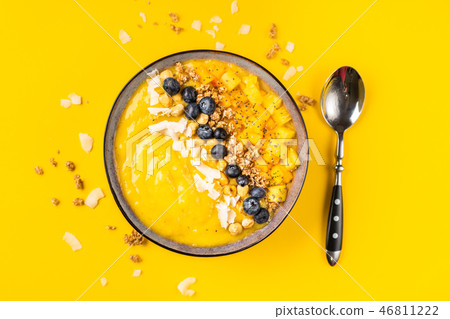 Top view of mango smoothie bowl with fruits Top view of mango smoothie bowl with fruits 46811222