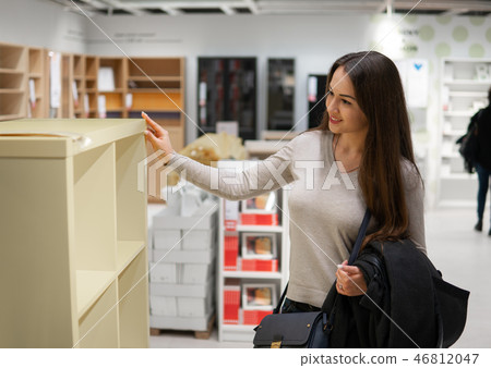 young beautiful woman finding herself new furniture, decoration 46812047