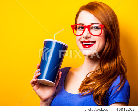 girl in blue dress and glasses with drink 46812202