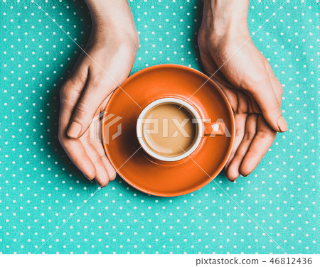 Female hand holding cup of coffee. Female hand holding cup of coffee. 46812436