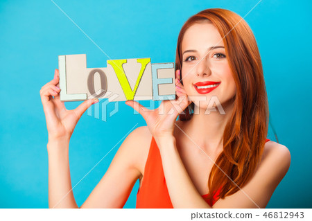 Happy redhead woman with word Love Happy redhead woman with word Love 46812943