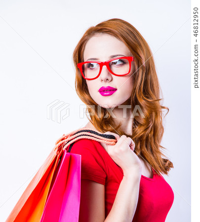 Redhead girl with shopping bags Redhead girl with shopping bags 46812950