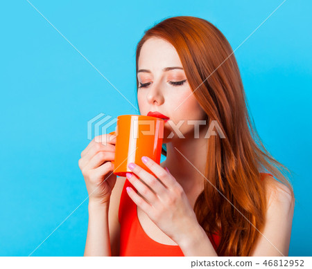 woman with cup on blue background. woman with cup on blue background. 46812952