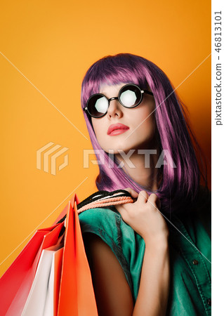 Woman in sunglasses with shopping bags Woman in sunglasses with shopping bags 46813101