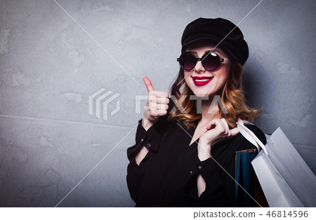 Style redhead girl in hat with shopping bags and sunglasses Style redhead girl in hat with shopping bags and sunglasses 46814596