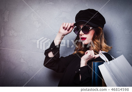 Style redhead girl in hat with shopping bags and sunglasses Style redhead girl in hat with shopping bags and sunglasses 46814598