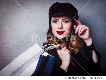 Style redhead girl in hat with shopping bags 46814599