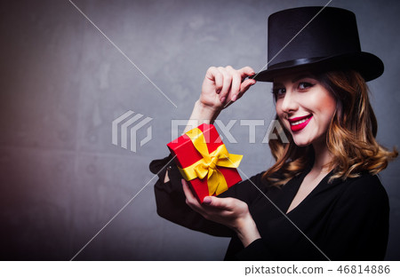 redhead girl in top hat with gift box redhead girl in top hat with gift box 46814886