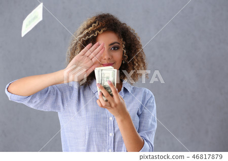 Beautiful black woman portrait. Scattering money notes 46817879