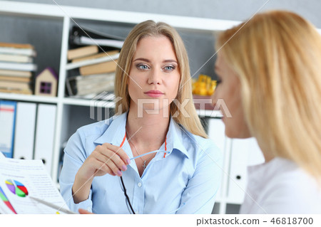 Young couple trying to get loan at bank clerk consultant Young couple trying to get loan at bank clerk consultant 46818700