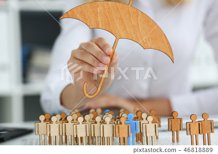 Smiling Business woman in hand holds a miniature Smiling Business woman in hand holds a miniature 46818889