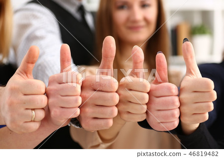 Group of people show OK or confirm with thumb up during conference 46819482