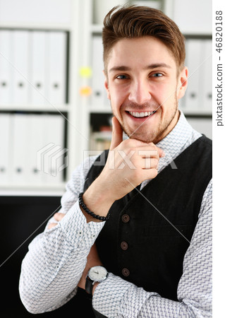 Handsome man in suit and tie stand in office Handsome man in suit and tie stand in office 46820188