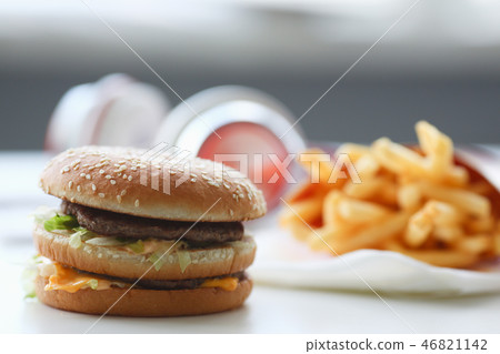 Hamburger and french fries with headphones Hamburger and french fries with headphones 46821142