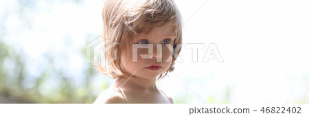 Happy little smiling child on a natural background Happy little smiling child on a natural background 46822402