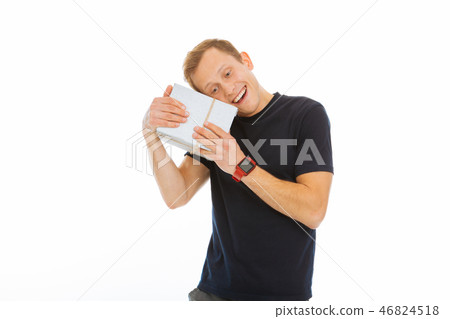 Positive young man feeling happy about the present Positive young man feeling happy about the present 46824518