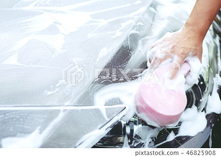 Female hand with pink sponge clean washing car Female hand with pink sponge clean washing car 46825908