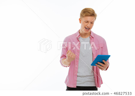 Joyful nice young man feeling very happy Joyful nice young man feeling very happy 46827533