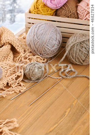 Woolen yarn and fabric on the window sill 46827834