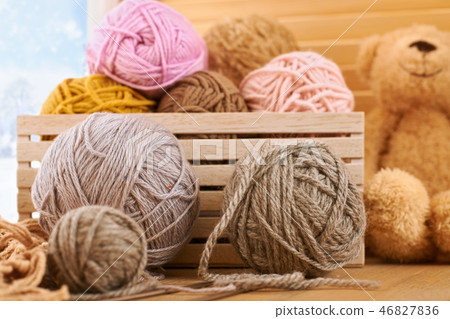 Woolen yarn and fabric on the window sill 46827836
