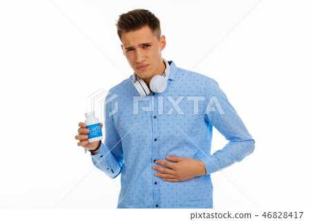 Sad depressed young man feeling strong pain Sad depressed young man feeling strong pain 46828417
