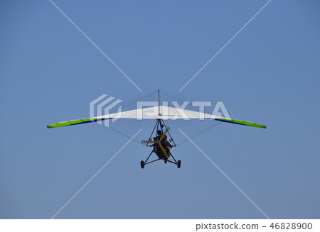 Trike, flying in the sky with two people Trike, flying in the sky with two people 46828900