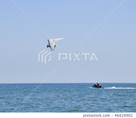 Trike, flying in the sky with two people 46828902