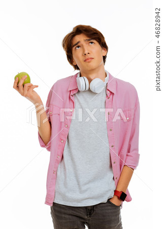 Nice thoughtful boy thinking about the apple Nice thoughtful boy thinking about the apple 46828942
