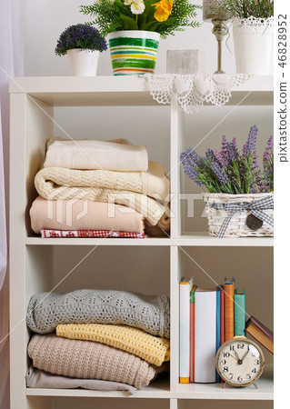 shelves with various things in the room 46828952