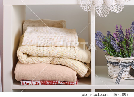 shelves with various things in the room 46828953