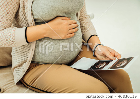 Pregnant woman receiving her ultrasound results on baby sex Pregnant woman receiving her ultrasound results on baby sex 46830119