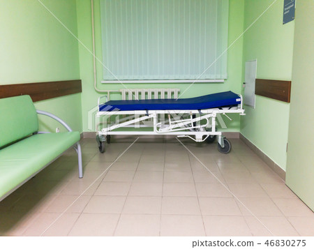 Cheap gurney in a poor hospital 46830275