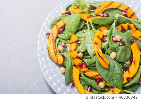 Autumn salad pumpkin spinach pomegranate chickpea 46830742