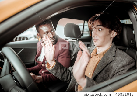 Student being inattentive and not listening to his driving teacher 46831013