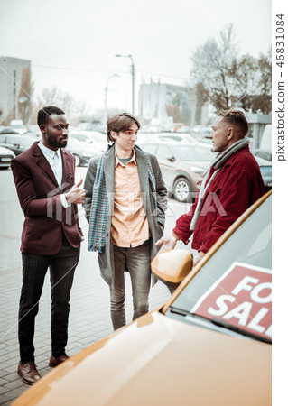 Father and son thinking about new passenger car for their family 46831084