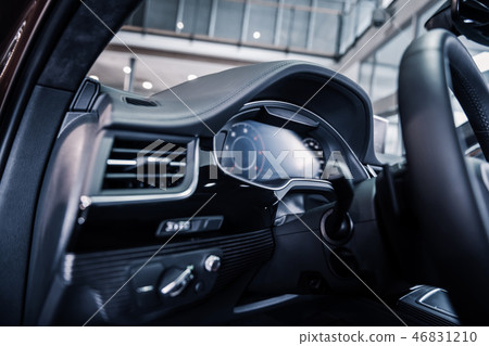 Close up of wheel inside new modern car with leather interior Close up of wheel inside new modern car with leather interior 46831210