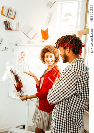 Handsome loving bearded man giving portrait of his girlfriend to her 46831335
