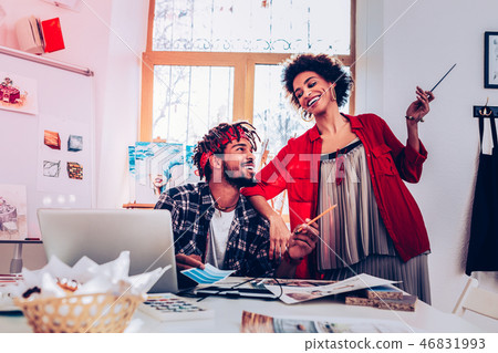 Happy girlfriend leaning on shoulder of her man working together 46831993