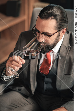 Top view of stylish mature businessman drinking some red wine 46832289