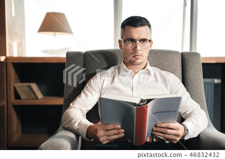 Smart promising lawyer reading the administrative law Smart promising lawyer reading the administrative law 46832432
