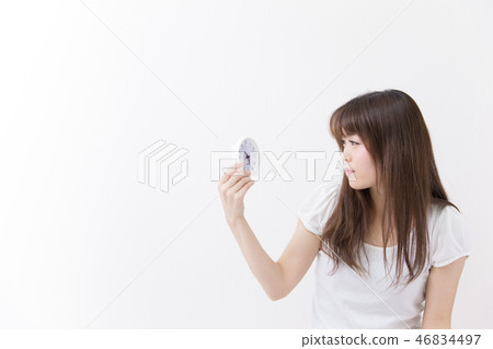 Alarm clock and ladies 46834497