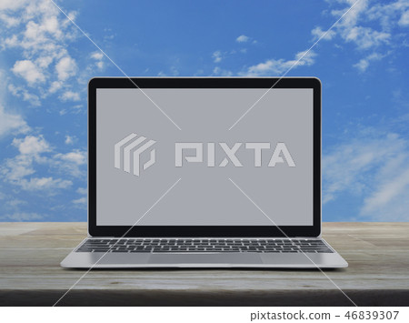 Laptop computer with blank screen on table Laptop computer with blank screen on table 46839307