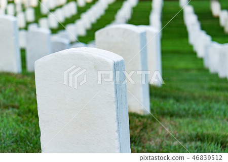 Grave stones on a peaceful cemetery. 46839512