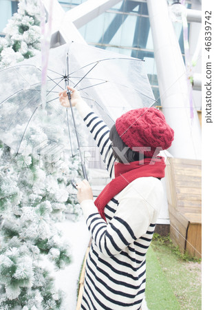 Girl in the garden of artificial snow 46839742