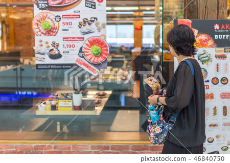 Asia women stand at front of barbecue restaurant Asia women stand at front of barbecue restaurant 46840750